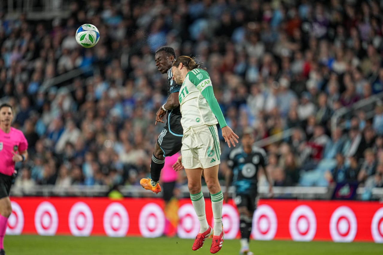 Kelvin Yeboah in an Aerial Duel with an Austin Defender