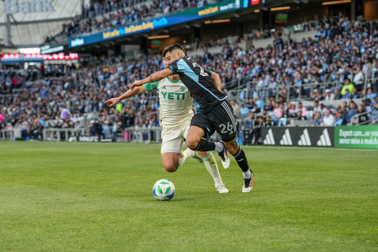 Joaquin Pereya Tries to Fend Off an Opponent