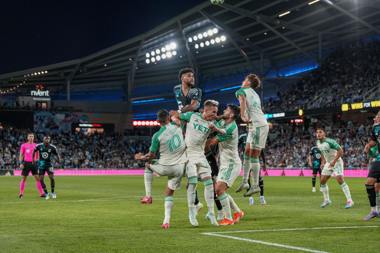 Carlos Harvey Fights for a Header in the Box
